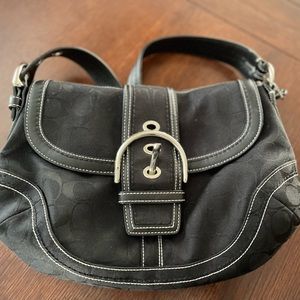 Used once like new and in great shape Coach shoulder bag.  White detail outline